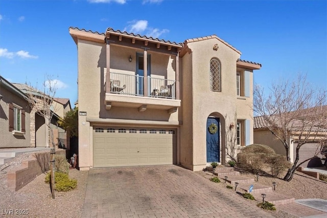 mediterranean / spanish house featuring a garage