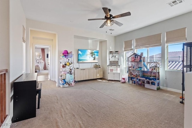 playroom featuring ceiling fan and carpet floors