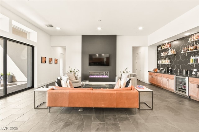 living room featuring bar and beverage cooler