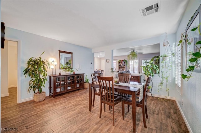 dining space with light hardwood / wood-style floors