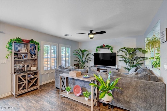 living room featuring ceiling fan