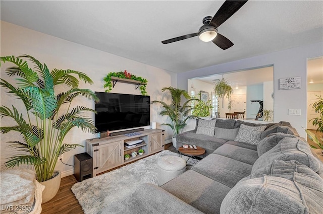 living room with hardwood / wood-style flooring and ceiling fan