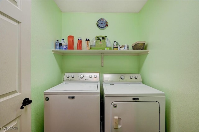 clothes washing area featuring washing machine and clothes dryer