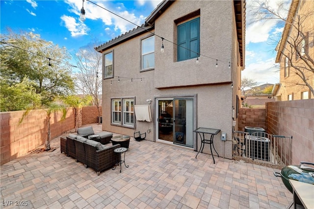 back of property with a patio and an outdoor hangout area