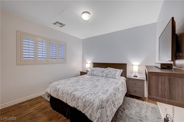 bedroom featuring dark hardwood / wood-style flooring