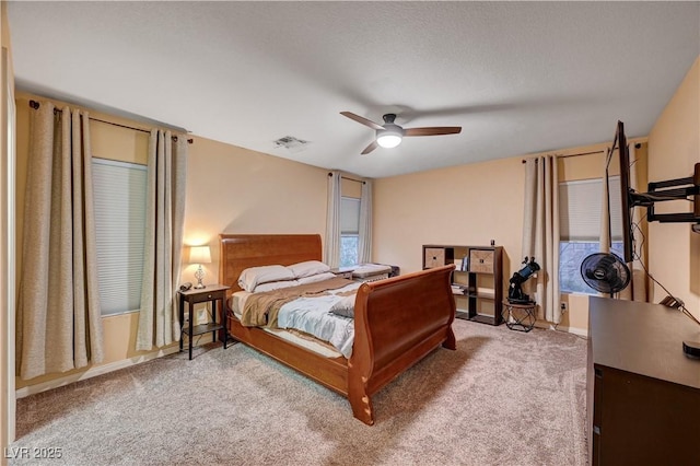 bedroom with ceiling fan and carpet