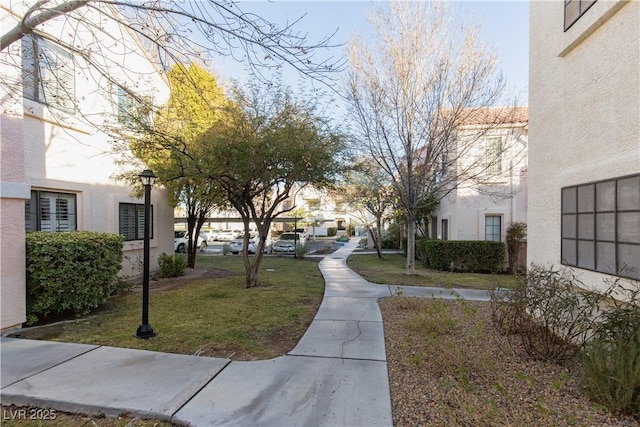 view of home's community featuring a lawn