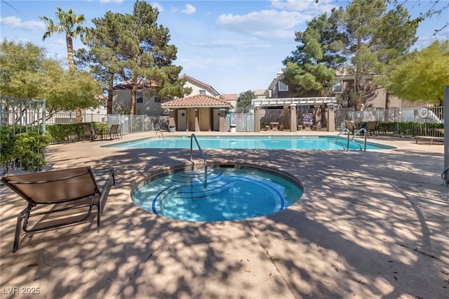 view of swimming pool with a pergola and a hot tub