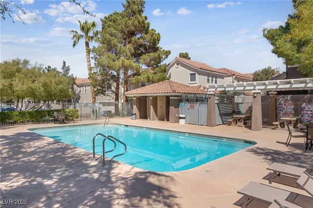 view of swimming pool with a pergola and a patio