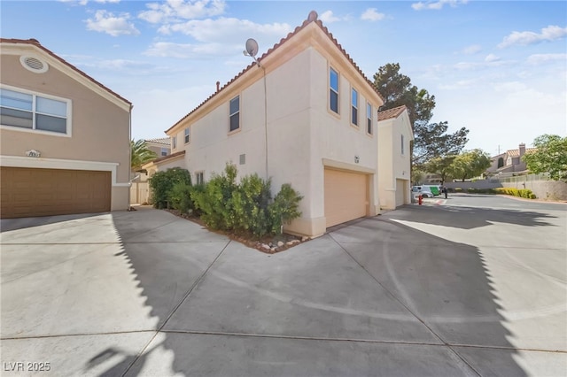 view of side of property featuring a garage