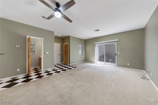 unfurnished room with light colored carpet and ceiling fan