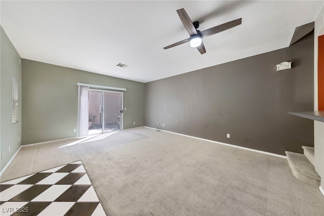 empty room with carpet and ceiling fan