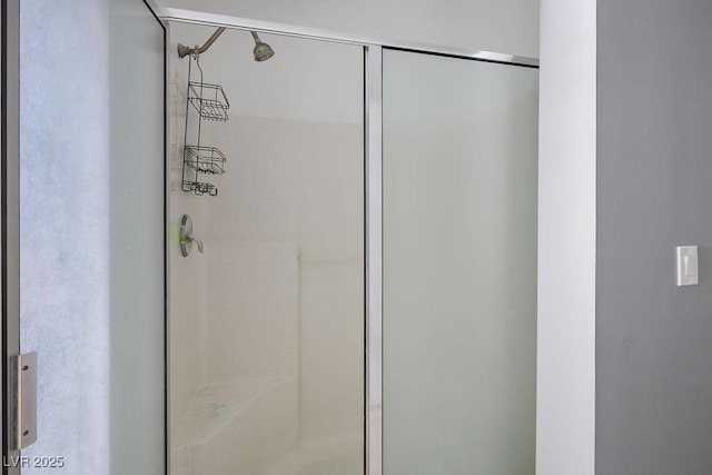 bathroom featuring an enclosed shower