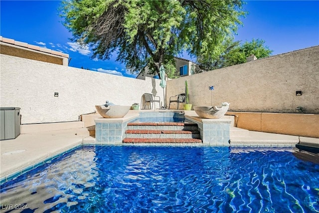 view of swimming pool featuring pool water feature