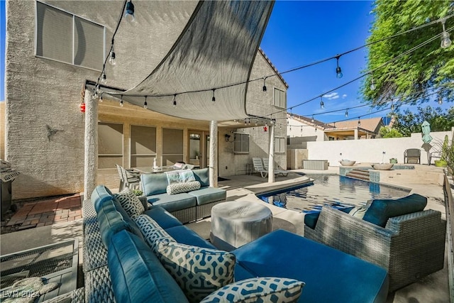 view of patio / terrace with a fenced in pool and outdoor lounge area