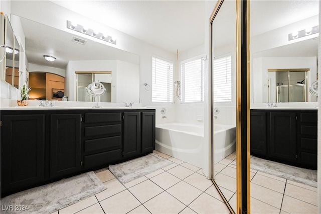 bathroom featuring vanity, tile patterned floors, and independent shower and bath