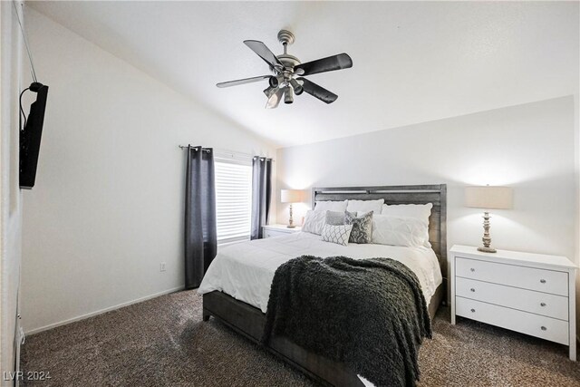 carpeted bedroom with ceiling fan and vaulted ceiling