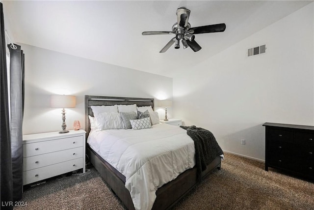 carpeted bedroom featuring ceiling fan and vaulted ceiling