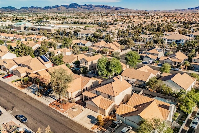 birds eye view of property with a mountain view