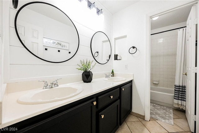 bathroom featuring vanity, tile patterned floors, and shower / bath combo with shower curtain