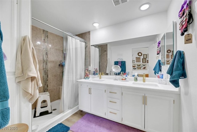 bathroom with a shower with curtain and vanity