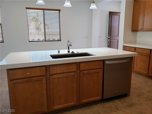 kitchen with dishwasher, sink, hanging light fixtures, a center island with sink, and light tile patterned floors