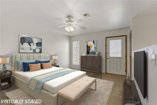 carpeted bedroom featuring ceiling fan