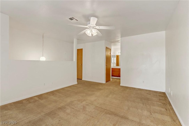 unfurnished room featuring ceiling fan and carpet floors