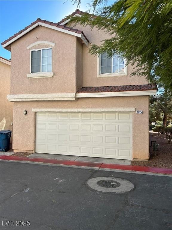 view of front of property featuring a garage