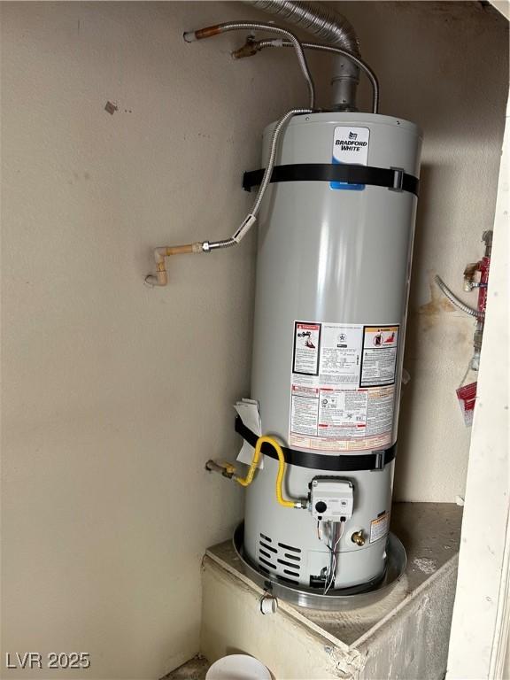 3025 Sunrise Bay Ave, North Las Vegas, NV 89031 - utility room featuring strapped water heater