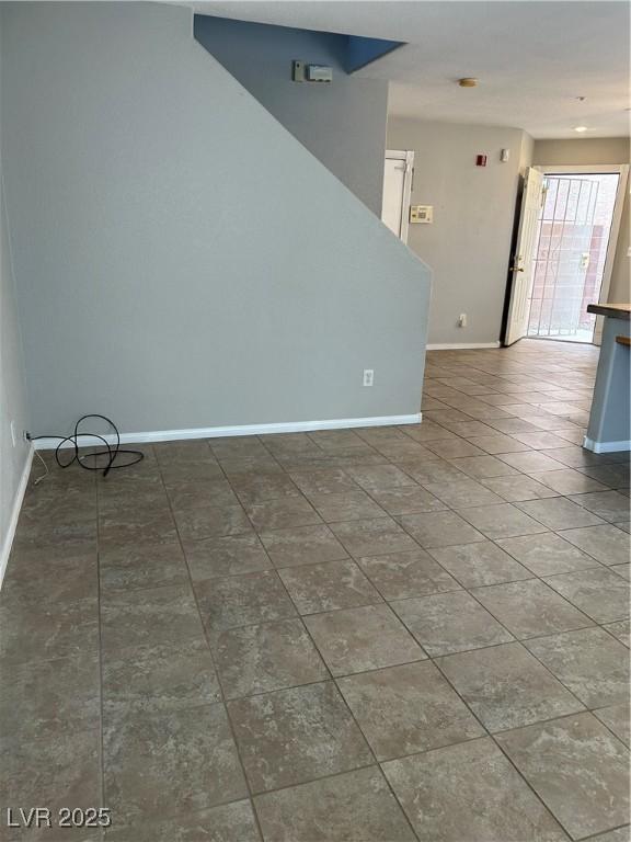 3025 Sunrise Bay Ave, North Las Vegas, NV 89031 - tiled spare room with baseboards