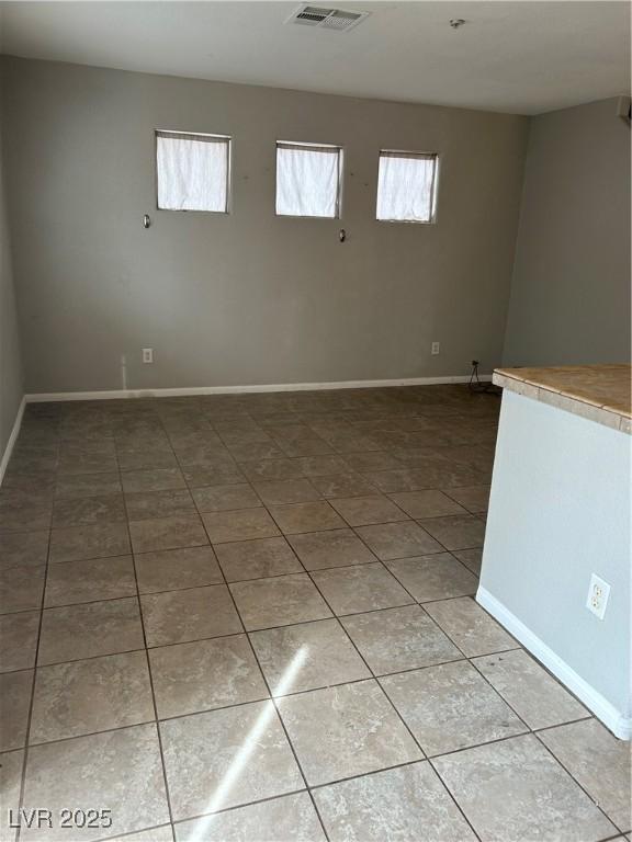 3025 Sunrise Bay Ave, North Las Vegas, NV 89031 - unfurnished room featuring light tile patterned flooring and baseboards