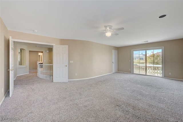 unfurnished room with ceiling fan and light carpet