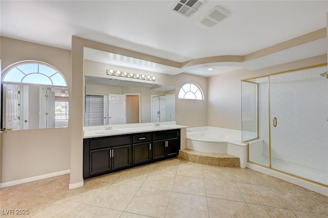 bathroom featuring tile patterned flooring, plenty of natural light, shower with separate bathtub, and vanity