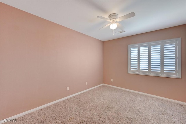 spare room with carpet flooring and ceiling fan