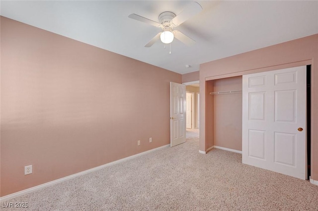 unfurnished bedroom with ceiling fan, a closet, and light colored carpet