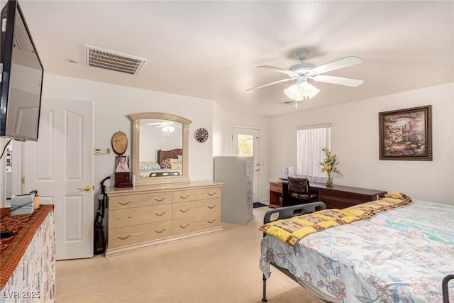 bedroom featuring light colored carpet and ceiling fan