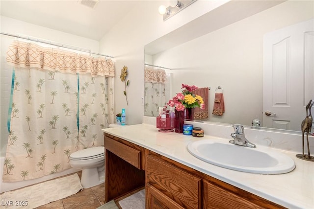 full bathroom featuring tile patterned flooring, vanity, shower / tub combo with curtain, and toilet