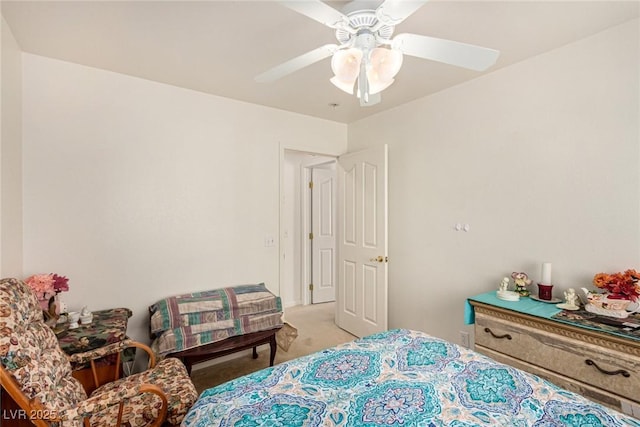 bedroom with ceiling fan and light carpet