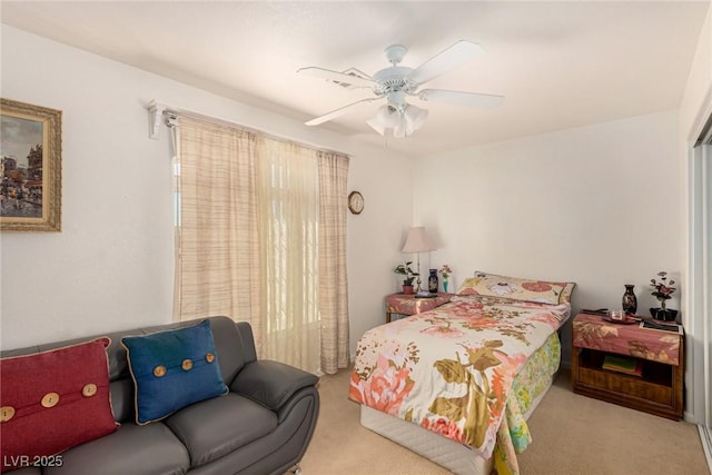 bedroom with light colored carpet and ceiling fan