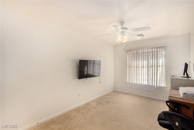 office featuring ceiling fan and light colored carpet