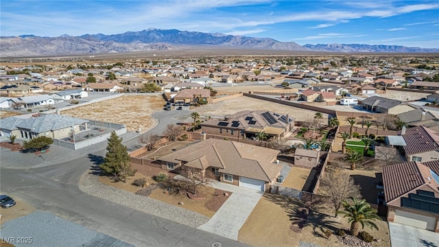 birds eye view of property with a mountain view