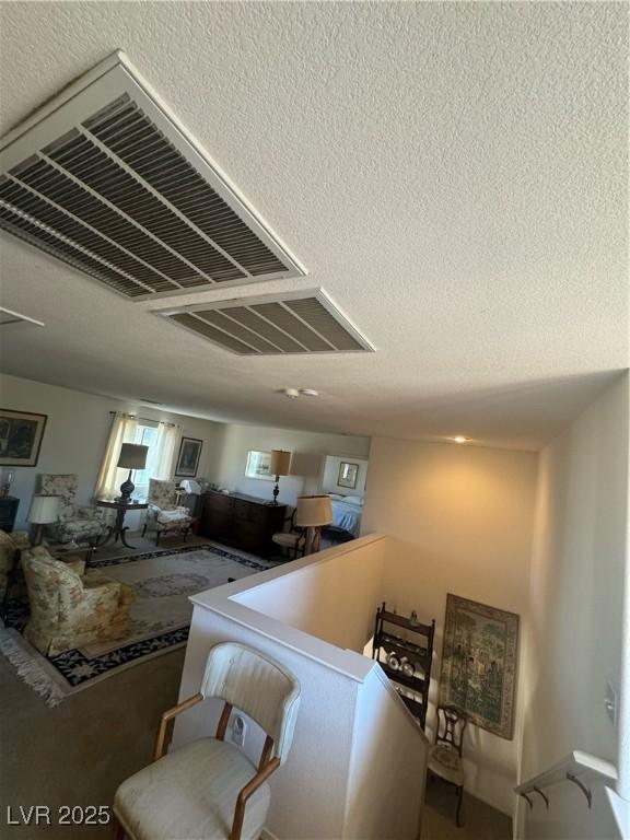 living room with a textured ceiling