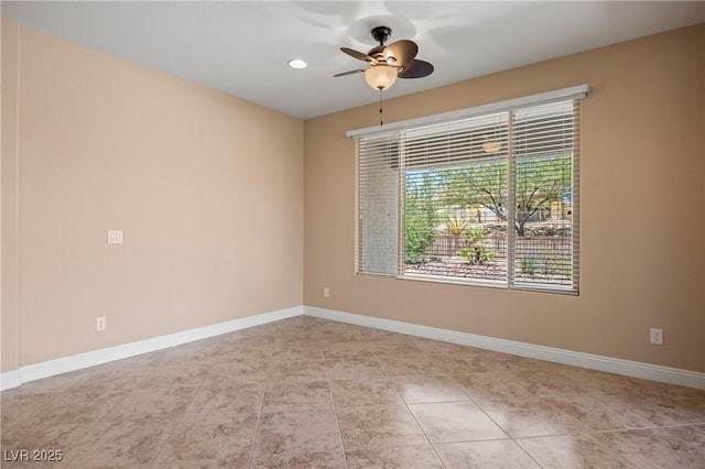 tiled empty room featuring ceiling fan