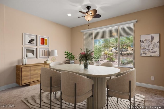 dining area featuring ceiling fan and light tile patterned flooring