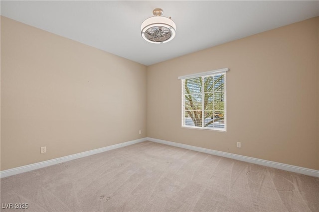 spare room with light colored carpet