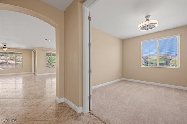 corridor with light tile patterned flooring