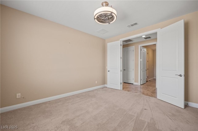 unfurnished bedroom with light colored carpet