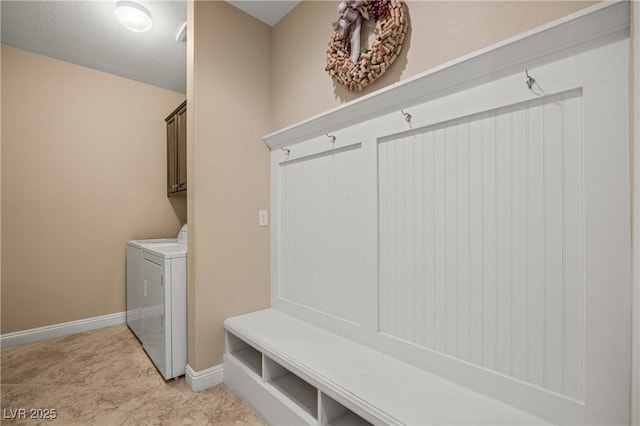 mudroom with separate washer and dryer