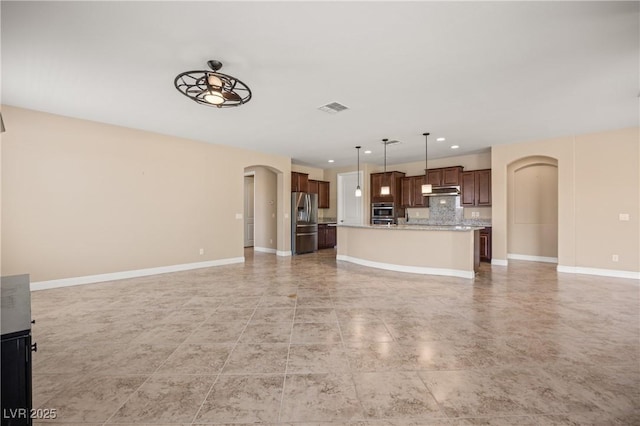 unfurnished living room featuring ceiling fan